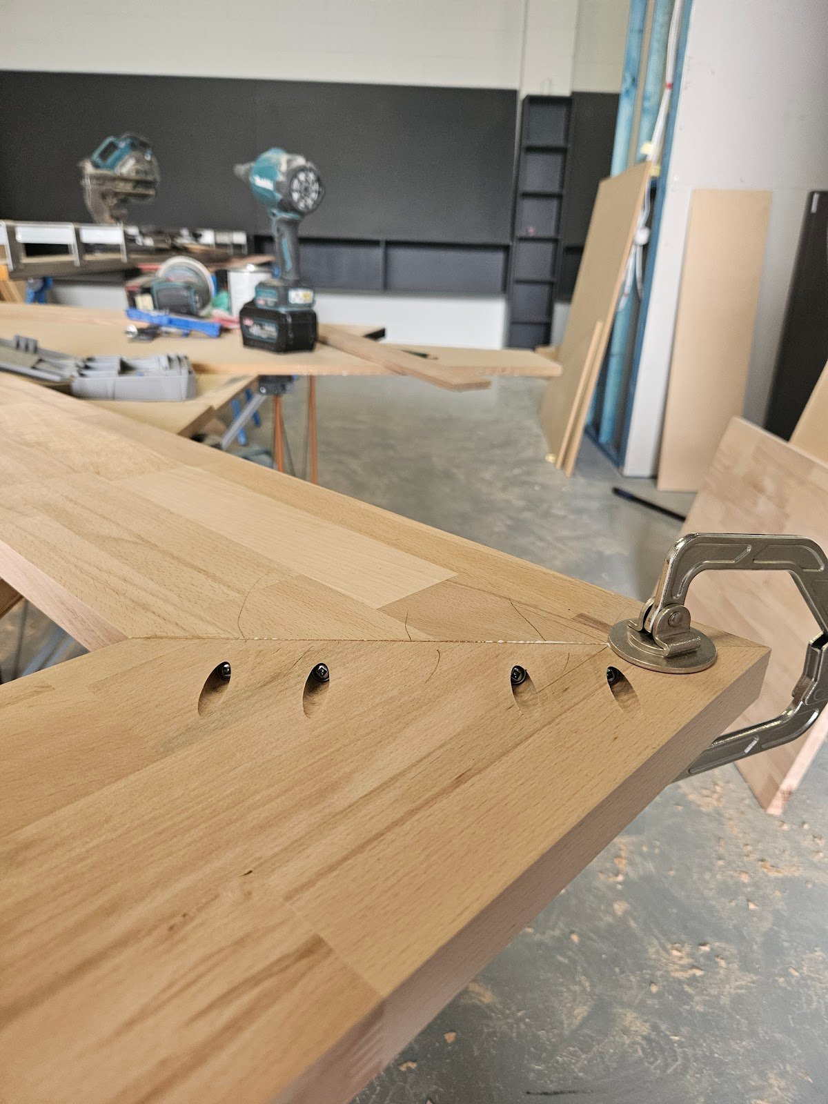 Master carpenter precision joinery, miter clamp, and solid timber benchtop in workshop by Yushin Kim